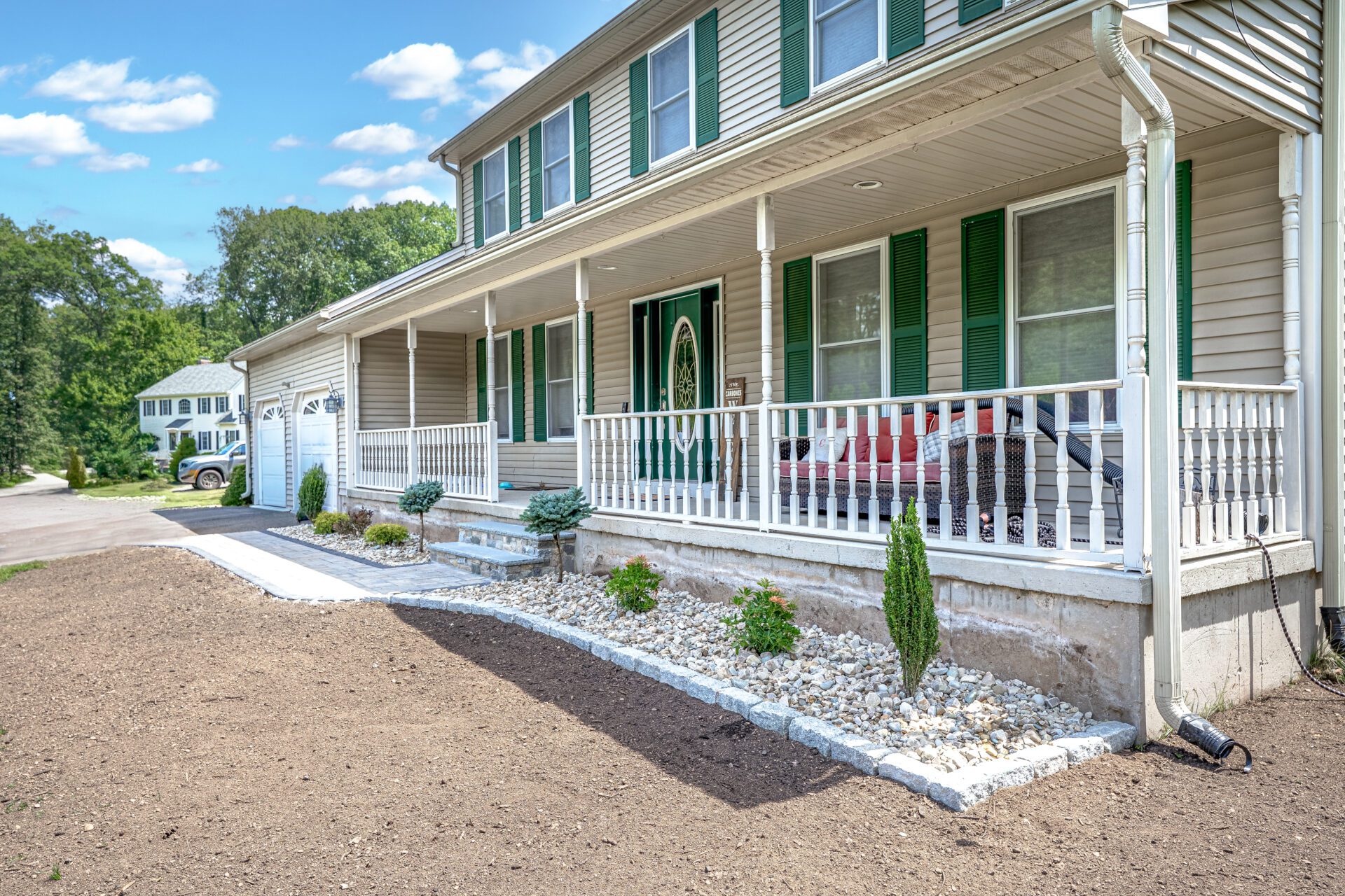 Front yard gravel and stone work with edging and shrubs in Southington CT